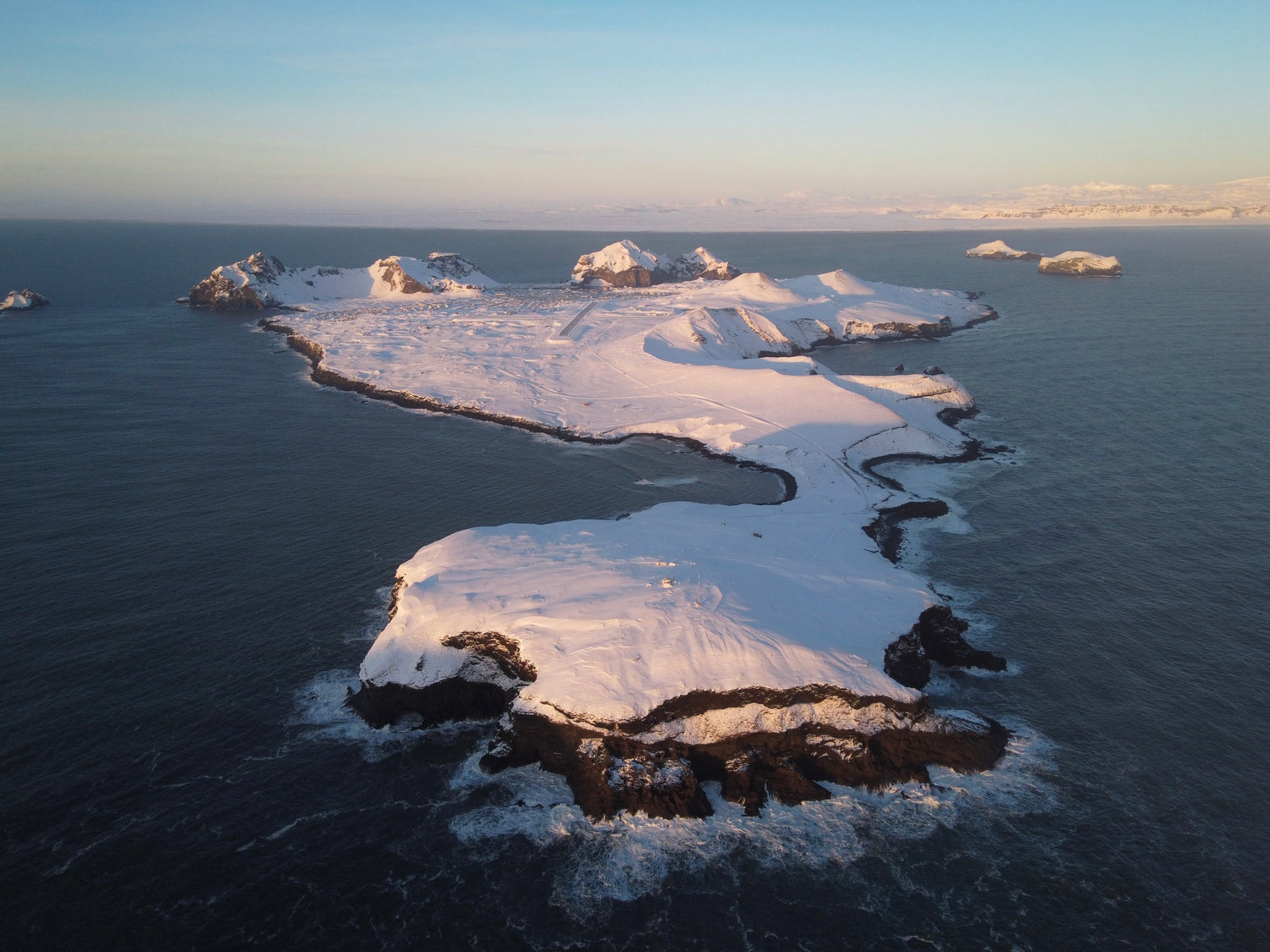 Snow-covered Heimaey landscape, the inspiration behind our gourmet flake salt's unique taste and purity